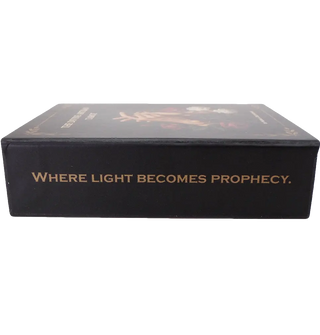 The Divine Artisan Tarot cards with matte black edges and dramatic light-and-shadow artwork